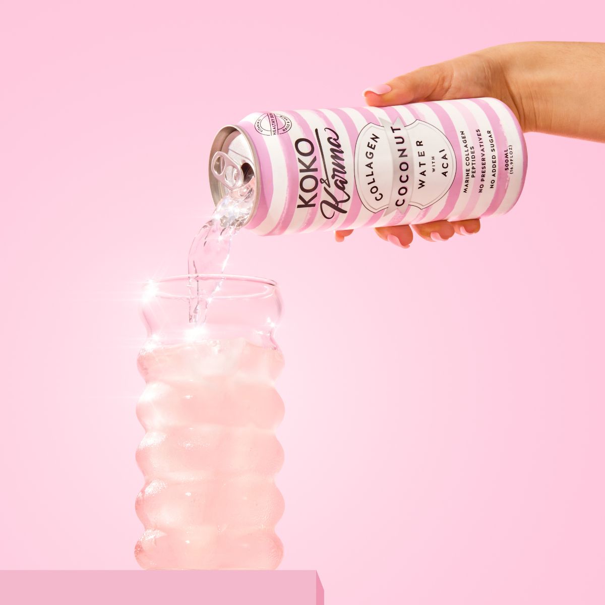 Pouring Acai Coconut Water from a Koko and Karma Can