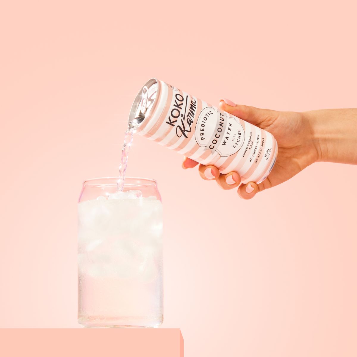 Pouring Lychee Coconut Water from Koko and Karma can