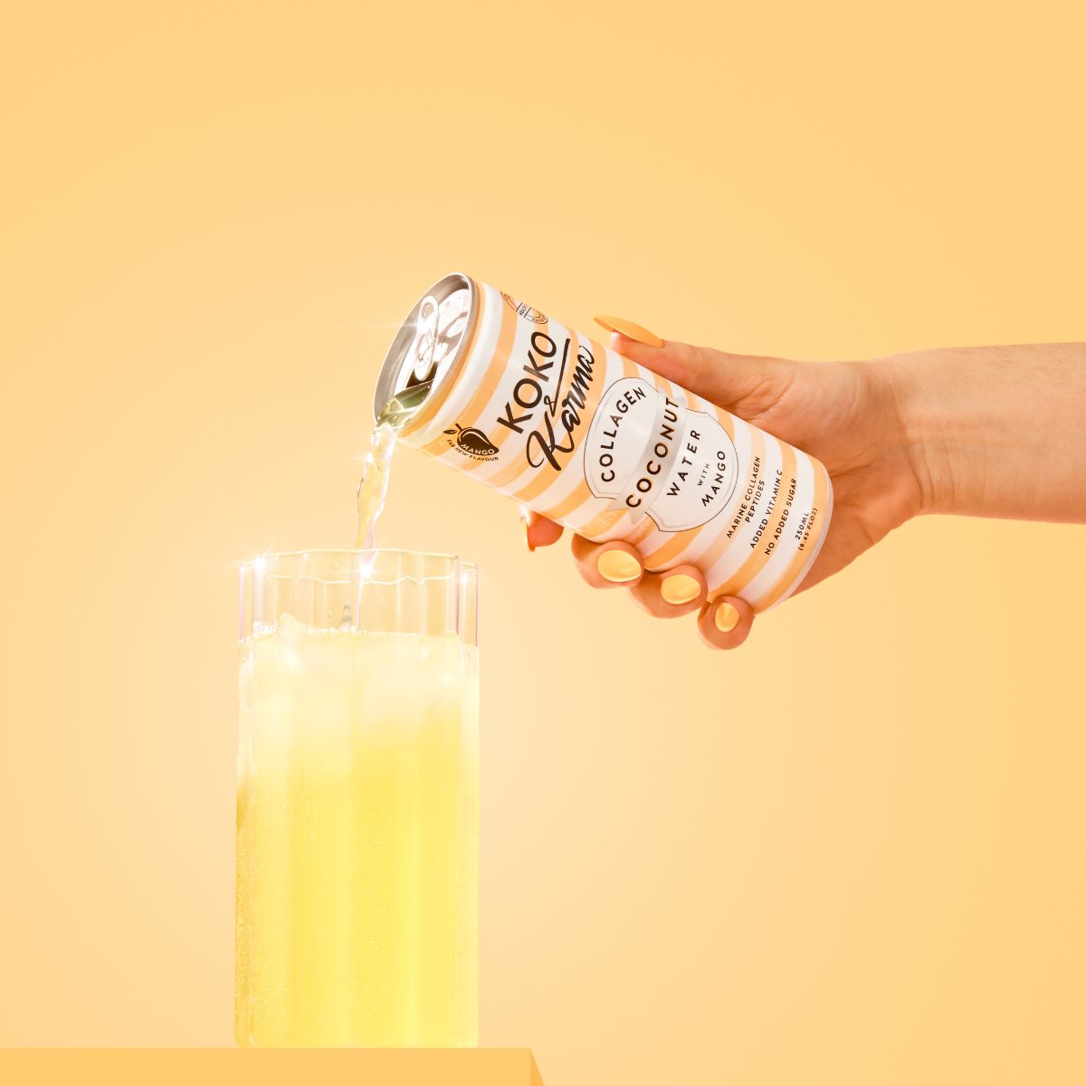 Pouring Mango Coconut Water from Koko and Karma Can